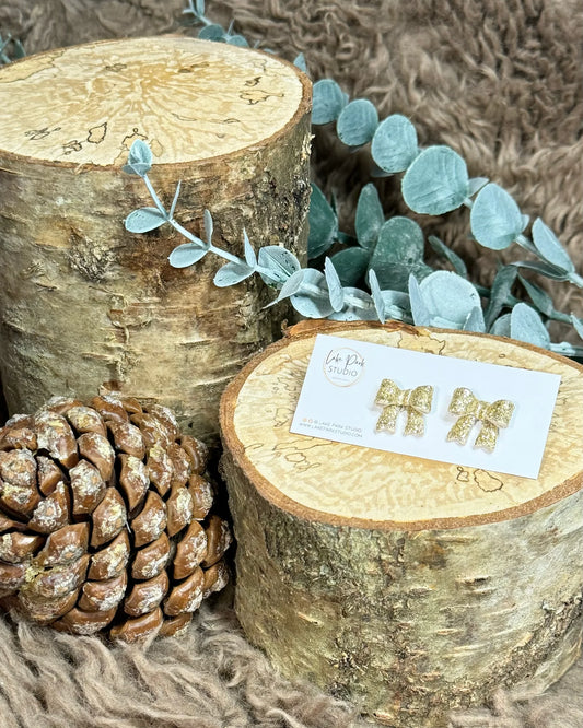 Små sløjfe ørestikkere - Guld Glitter