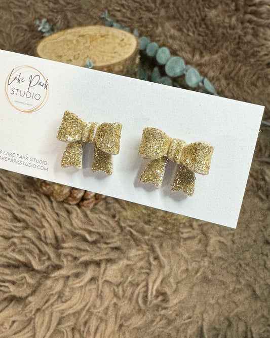 Små sløjfe ørestikkere - Guld Glitter